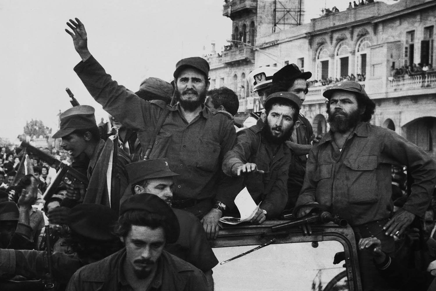 Fidel Castro, with his fellow revolutionaries, entering Havana on January 8, 1959. They are surrounded by crowds of people  after their overthrow of Fulgencio Batista's dictatorship. - (BSLOC_2015_1_39)